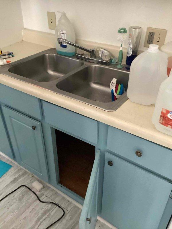 Responded to service call for frozen and damaged plumbing pipes beneath kitchen sink. Replaced compromised PVC drain assembly including P-trap configuration with new white PVC piping and fittings. Verified proper drainage flow and checked all connections for leaks before completing installation.