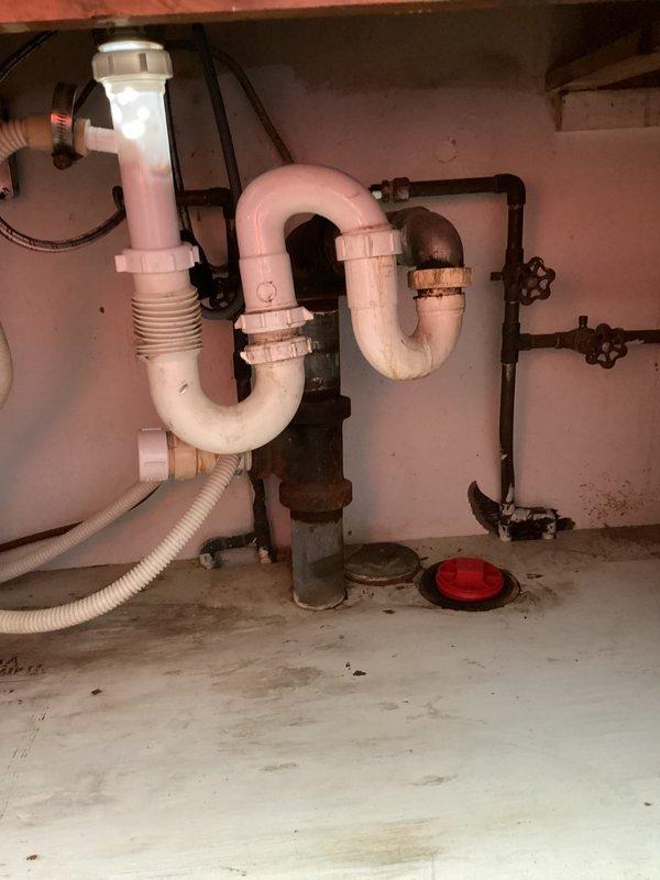 Responded to service call for main drain cleanout as required by inspection and laundry room drain issues. Accessed main cleanout assembly and removed blockage from primary drain line using appropriate drain cleaning equipment. Cleared obstruction and restored proper flow through the drainage system. Inspected laundry room drain connections including P-trap assembly and verified all fixtures were draining correctly. Tested water flow through both the main line and laundry room drainage to confirm complete clearance and proper operation of all plumbing components.