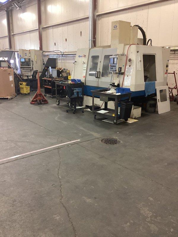 Relocated existing floor drain approximately 5 feet to accommodate building addition at commercial manufacturing facility. Performed site assessment and measurements to determine new drain placement in concrete floor of active machine shop housing CNC equipment. Successfully repositioned main ground water drain to align with customer's expansion requirements while maintaining proper drainage function.