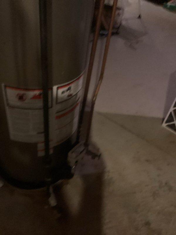 Completed installation of customer-supplied tankless water heater unit in basement mechanical room, replacing existing conventional tank water heater. Reconfigured and repositioned existing copper supply and return lines to accommodate new tankless unit mounting location and connection points. Verified all plumbing connections, tested system operation, and ensured proper venting and combustion air requirements were met for safe operation of the new tankless water heating system.