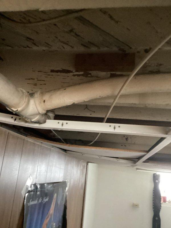 Responded to gas leak call and performed comprehensive inspection of residential natural gas system. Located leak in existing gas line running through basement ceiling area. Replaced compromised section of gas piping with new code-compliant materials, ensuring proper threading and secure connections. Installed appropriate support brackets and straps to secure new piping to ceiling joists. Verified gas meter operation and shutoff valve functionality. Conducted pressure test on repaired gas line system to confirm leak elimination and system integrity. All connections tested and verified leak-free using approved detection methods. System returned to safe operating condition with proper safety tags and warnings in place.