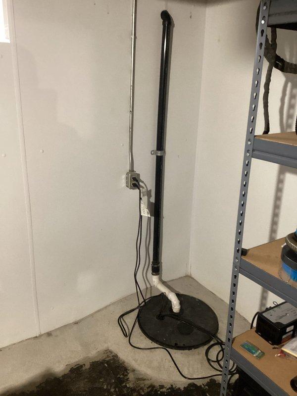 Responded to main line backup issue and conducted thorough assessment of the drainage system. Documented existing sump pump installation in basement and exterior foundation drainage configuration, then provided estimate for complete main line replacement due to persistent backup problems.
