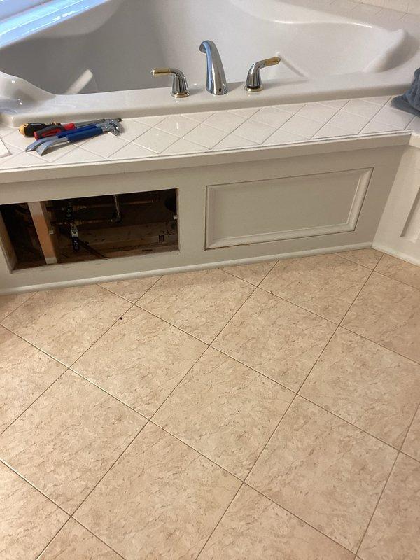 Responded to service call for leak verification and Roman tub faucet repair. Conducted thorough inspection of plumbing fixtures and connections throughout the affected areas to verify no active leaks were present following previous repairs. Inspected under-sink plumbing, shut-off valves, and supply line connections at bathroom vanity. Examined Roman tub faucet assembly and identified leak at faucet fixture requiring attention. Verified all accessible plumbing connections were secure and dry, confirming system integrity before customer proceeds with ceiling restoration work.