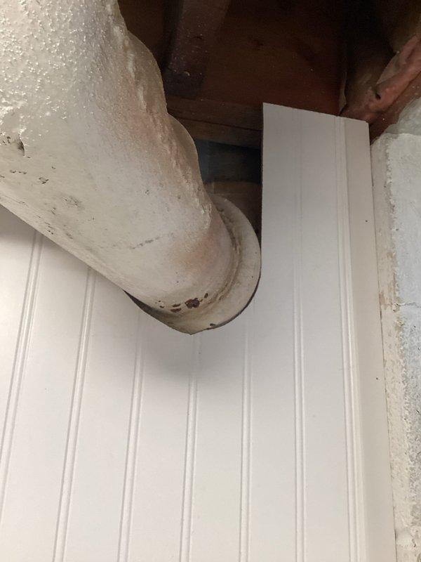 Inspected and assessed main drain stack system from basement level through first floor toilet connection. Previous evaluation covered lower section of stack only; expanded scope to include upper portion at first floor toilet elbow junction. Documented condition of white PVC drain line where it emerges through ceiling in lower level, noting curved elbow section and connection points. Examined first floor toilet installation and drain connection to verify proper tie-in to main stack. Photographed exposed plumbing runs, structural penetrations, and toilet fixture to document existing conditions for recommended repair work on compromised stack section.