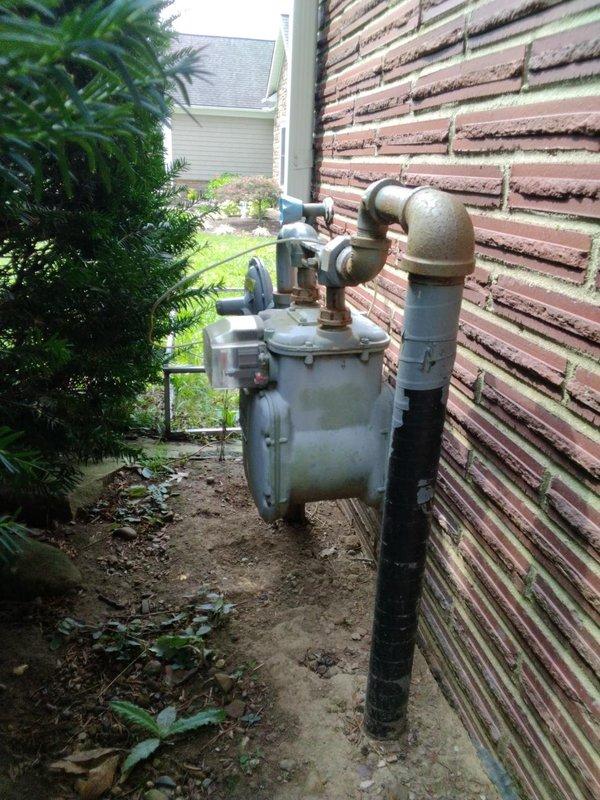 Installed 45 feet of 1.25-inch gas piping from exterior meter location through interior utility room to appliance connection point. Routed black iron pipe along exterior wall, penetrated building envelope, and ran distribution line through mechanical room using proper supports and hangers per code requirements. Obtained Stark permit and completed installation with pressure testing and final inspection.
