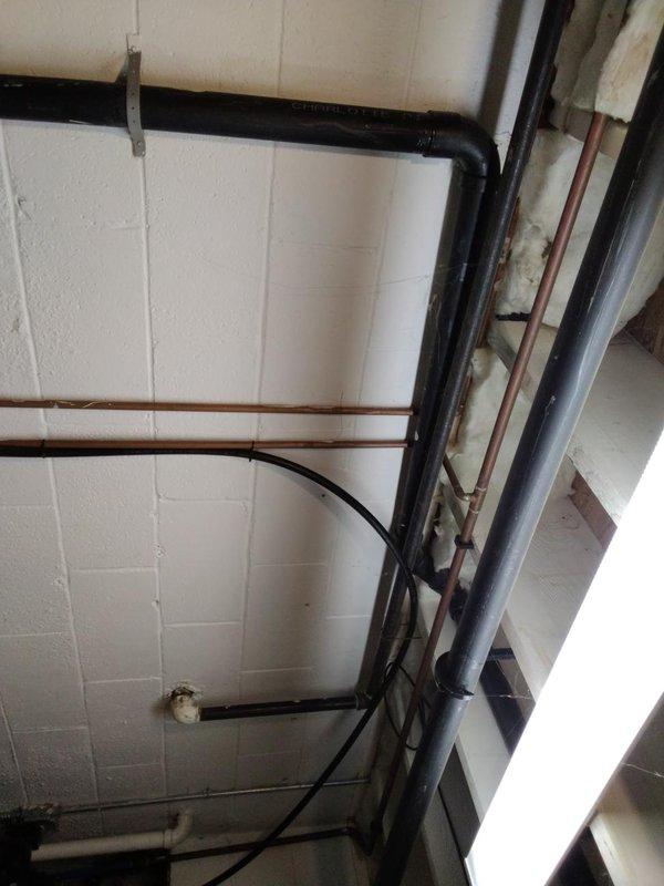 Installed 45 feet of 1.25-inch gas piping from exterior meter location through interior utility room to appliance connection point. Routed black iron pipe along exterior wall, penetrated building envelope, and ran distribution line through mechanical room using proper supports and hangers per code requirements. Obtained Stark permit and completed installation with pressure testing and final inspection.