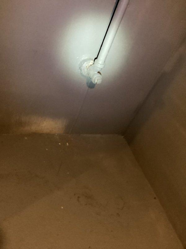 Responded to a clogged kitchen sink and inspected the drain line from the under-sink cabinet through the accessible basement drain piping, including the P-trap, elbow fittings, and branch connections. Cleared the obstruction from the drain line, restoring proper flow, and verified normal drainage at the fixture.