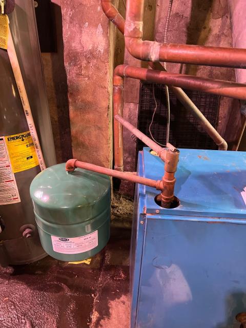 Visited a home in philadelphia, pa 19147 to inspect a boiler that wasn’t lighting properly after the homeowner attempted to replace the thermocouple. Found multiple issues, including a bad aquastat relay, a leaking expansion tank, and a minor gas leak at the pilot light connection. Drained the boiler, replaced the expansion tank and aquastat relay, repaired the gas leak, and bled the radiators. System tested and operating safely—backed by a 1-year part and labor warranty for peace of mind.