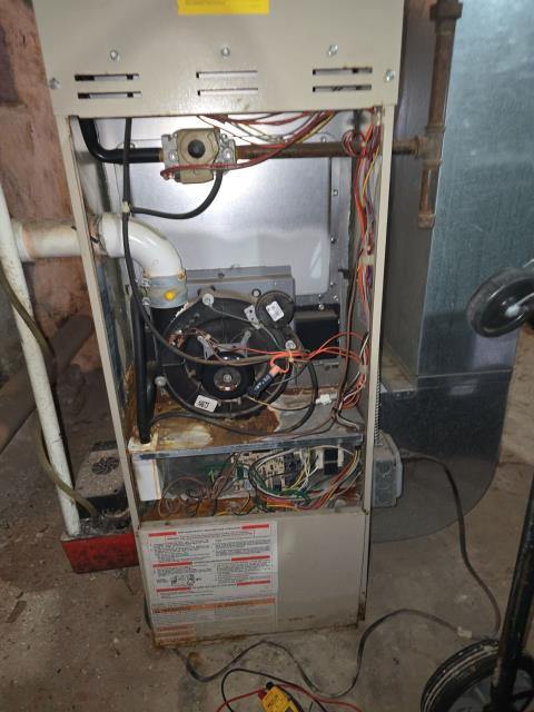 Responded to an emergency no-heat call at a residential home after a 20-year-old basement gas furnace shut down following a reported buzzing noise. Our technician diagnosed a failing exhaust (inducer) motor and noted significant rust and age-related wear, recommending motor replacement and reviewing safety concerns. We also provided furnace-only and full ac/heating replacement estimates for future planning, allowing the homeowner time to review options and decide on next steps.