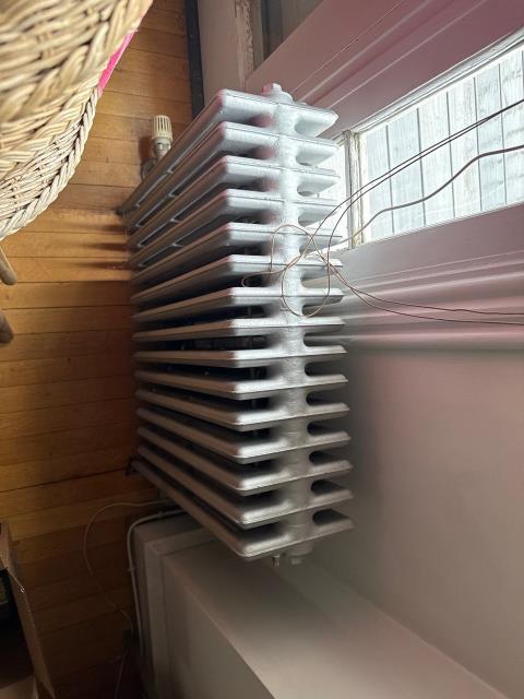 We addressed a heating issue in a multi-unit building. The third-floor tenant reported cold temperatures and no thermostat. We confirmed the apartment lacked individual control due to the building's 6 heating zones. We discussed potential solutions with the owner.