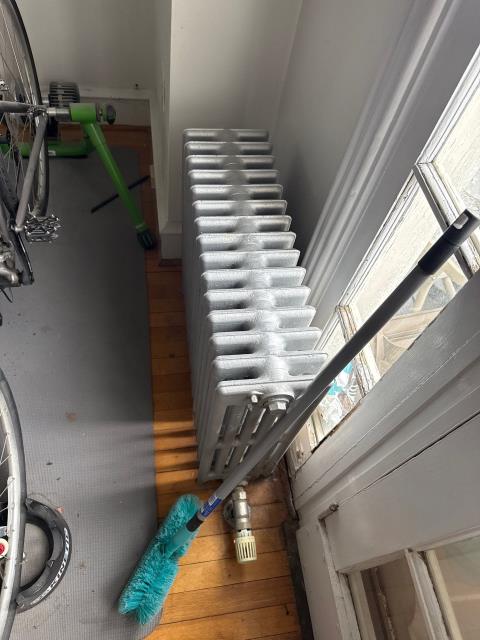 We addressed a heating issue in a multi-unit building. The third-floor tenant reported cold temperatures and no thermostat. We confirmed the apartment lacked individual control due to the building's 6 heating zones. We discussed potential solutions with the owner.
