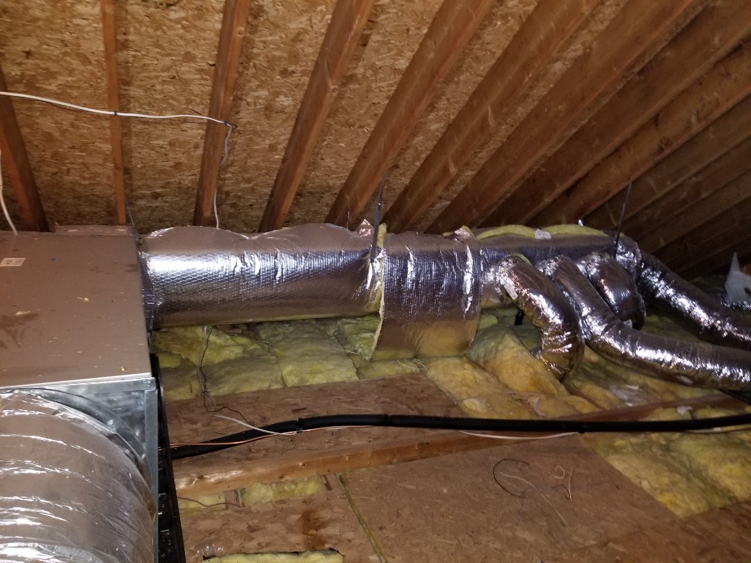 Air conditioning tune up on Carrier AC. All working at this time, but duct insulation had fallen off one section of supply duct. Taped insulation back on, but all seams should be sealed to prevent moisture from getting between insulation and ductwork. 