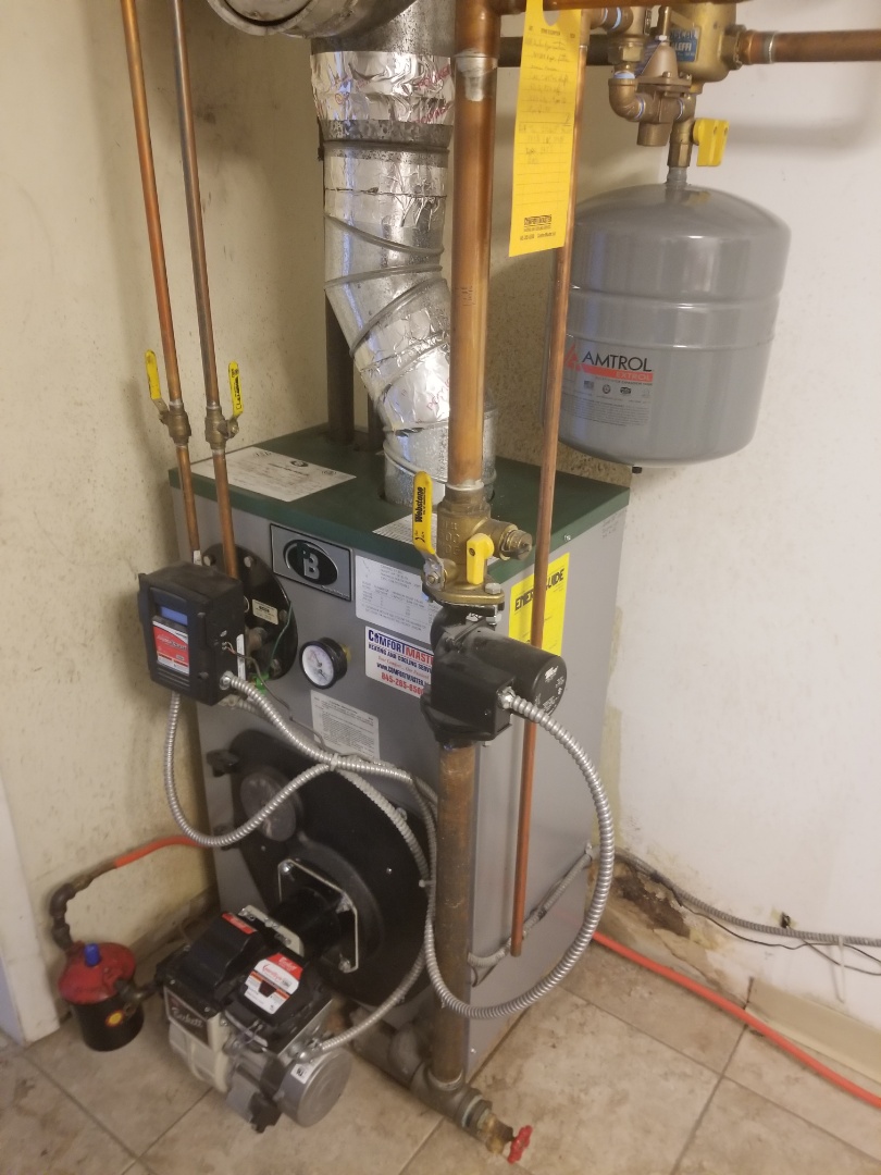 Peerless oil boiler not producing enough hot water. Performed annual maintenance tune up, and recommended chemical cleaning of tankless water heater coil.