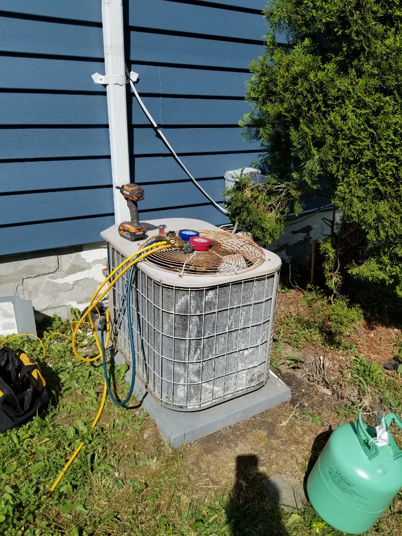 York air conditioning unit frozen and not cooling. Found system low on freon and recharged. System has a leak and based on age and condition, it would make more sense to replace equipment rather than repair it. 