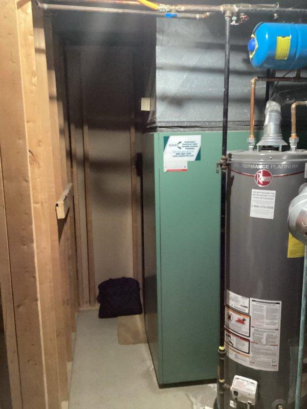 Conducted comprehensive evaluation of 47-year-old furnace in basement. Unit shows significant age deterioration and is positioned in a confined utility space alongside a Performer Platinum water heater. Recommended complete replacement due to equipment age exceeding standard operational lifespan, which presents efficiency concerns and potential safety risks. Provided customer with replacement options suitable for the existing installation configuration.