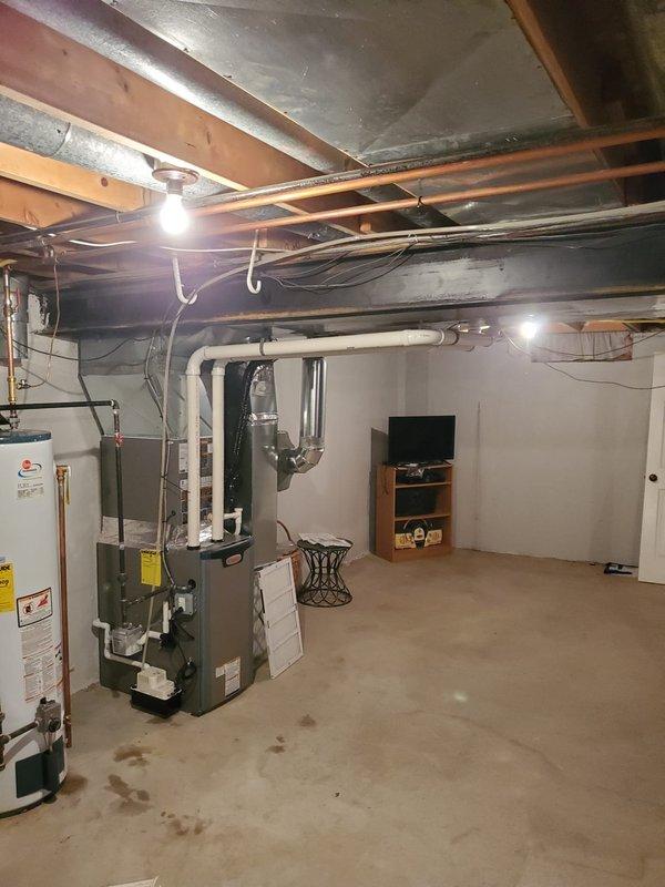 Successfully installed new Lennox furnace in basement mechanical area, replacing existing unit. Corrected improper venting system with new properly secured ductwork to eliminate bowing issues. Installed new radiused boot for improved airflow distribution while retaining recently installed condensate pump from previous AC installation.