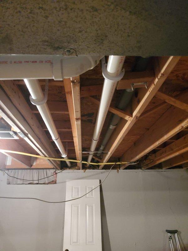 Successfully installed new Lennox furnace in basement mechanical area, replacing existing unit. Corrected improper venting system with new properly secured ductwork to eliminate bowing issues. Installed new radiused boot for improved airflow distribution while retaining recently installed condensate pump from previous AC installation.