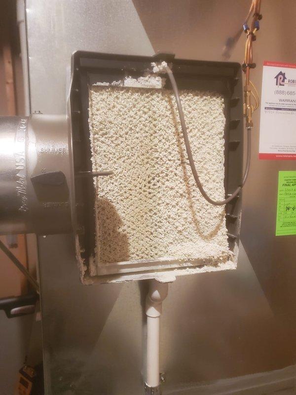 Performed annual furnace maintenance service, which included inspection and cleaning of the humidifier assembly. Removed cover to examine evaporative pad condition and water supply line functionality. Also conducted inspection of furnace interior components including blower motor assembly, wiring connections, and circuit board to verify proper operation and electrical integrity.