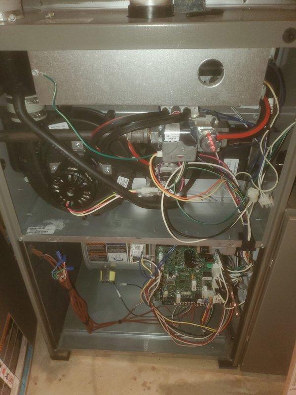 Performed annual furnace maintenance service, which included inspection and cleaning of the humidifier assembly. Removed cover to examine evaporative pad condition and water supply line functionality. Also conducted inspection of furnace interior components including blower motor assembly, wiring connections, and circuit board to verify proper operation and electrical integrity.