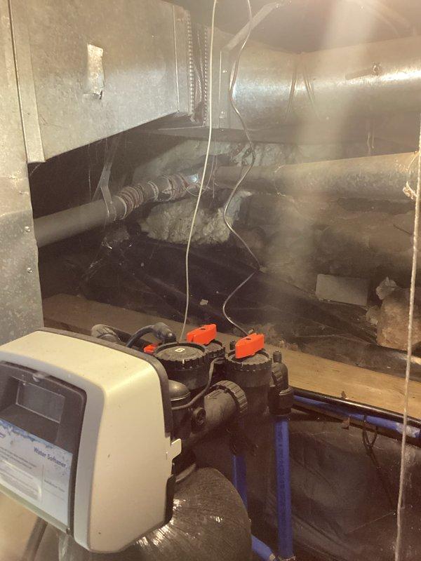 Conducted inspection of 32-year-old furnace after previous technician condemned heat exchanger and blower motor. Confirmed failure of both components during visual assessment. Documented existing installation in mechanical room, noting significant age-related deterioration and suboptimal installation environment with dust accumulation and confined space constraints.