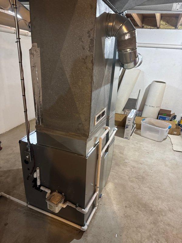 Successfully installed new Lennox furnace with S40 thermostat in basement utility room. Complete installation included proper connection of metal ductwork, PVC ventilation pipes with sealed joints, and all necessary condensate drainage components. System was fully tested and is operating according to manufacturer specifications.