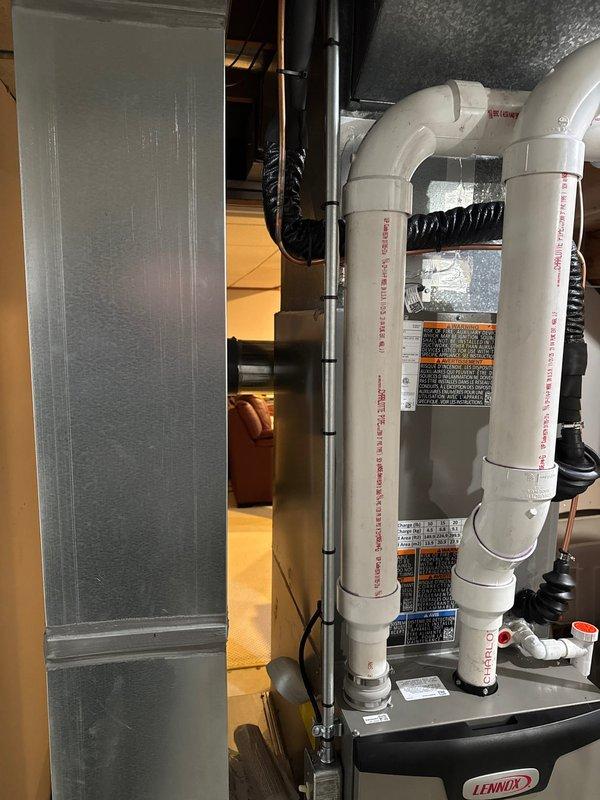 Successfully installed a new Lennox complete HVAC system, including furnace, air conditioner, S40 thermostat, and humidifier. System installation included proper PVC ventilation/drainage components with appropriate connections and a condensate pump. All equipment was professionally mounted with proper copper line connections and flexible ductwork in the utility area.
