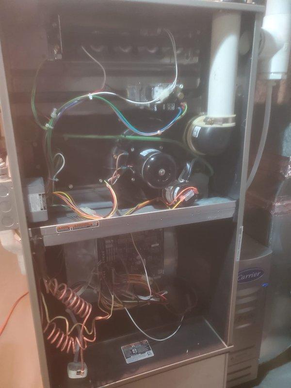 Performed scheduled routine maintenance on 8-year-old Carrier furnace. Inspected interior components including blower motor, control board, wiring connections, and heat exchanger - all in normal working condition with minimal dust accumulation. System is functioning properly with no operational issues identified. Maintenance contract extends through 2025.