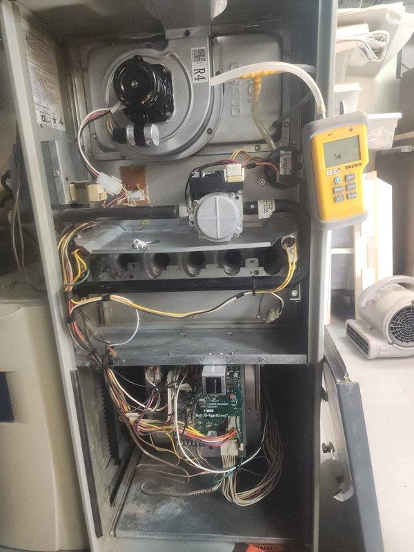 Responded to no heat complaint on aging American Standard furnace system. Performed diagnostic testing using digital analyzer which revealed faulty ignition sequence. Cleaned flame sensor and control board connections, replaced worn blower motor capacitor, and verified proper gas valve operation. System now functioning with normal heat output and proper cycling.