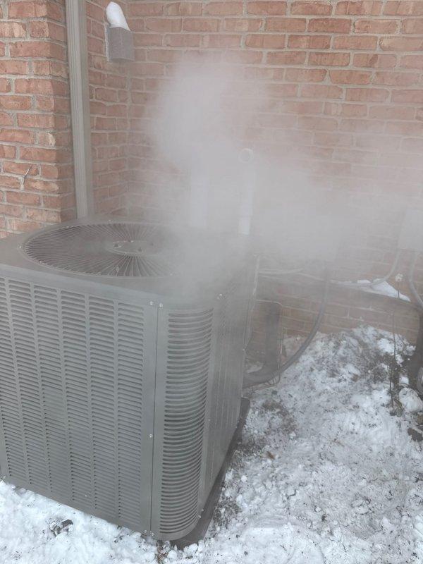 Completed installation of a comprehensive HVAC system including dual Lennox furnaces, an air conditioning unit, 50-gallon water heater, and two humidifiers. Properly installed outdoor AC condensing units against exterior brick wall with appropriate electrical disconnects, PVC piping, and necessary connections. Verified system operation in winter conditions, with units functioning as designed.