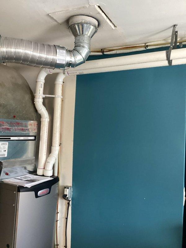 Successfully installed a Lennox downflow furnace in the residential mechanical room, with proper connection to existing ductwork system including metal tape at seams for proper sealing. Installed PVC venting system according to specifications, with all connections secured and system tested for proper operation.