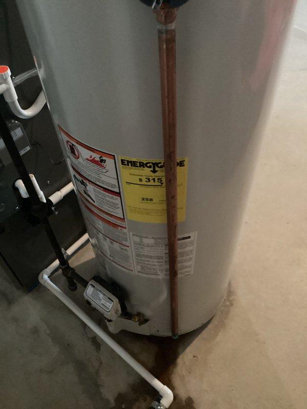 Conducted water heater replacement estimate for customer experiencing no hot water. Inspected existing unit which showed normal installation with copper and PVC piping connections but confirmed non-functioning status. Provided replacement options for standard tank-style water heater with appropriate capacity for the residence.