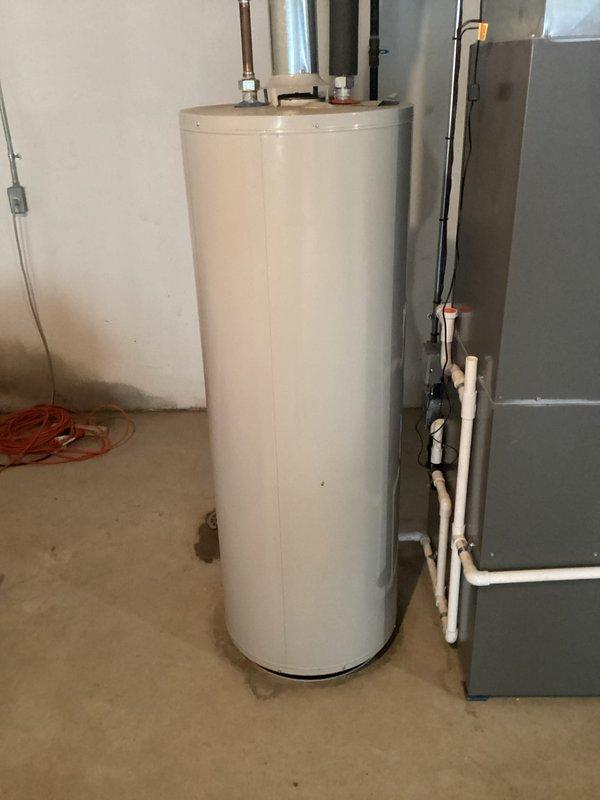 Conducted water heater replacement estimate for customer experiencing no hot water. Inspected existing unit which showed normal installation with copper and PVC piping connections but confirmed non-functioning status. Provided replacement options for standard tank-style water heater with appropriate capacity for the residence.
