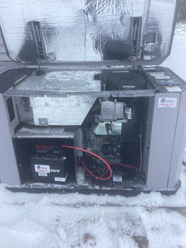 Performed scheduled generator maintenance service. Inspected and replaced spark plugs on Ultraguard unit. Noted significant frost and ice buildup on internal components including battery terminals and control mechanisms, which was addressed to ensure proper system operation.