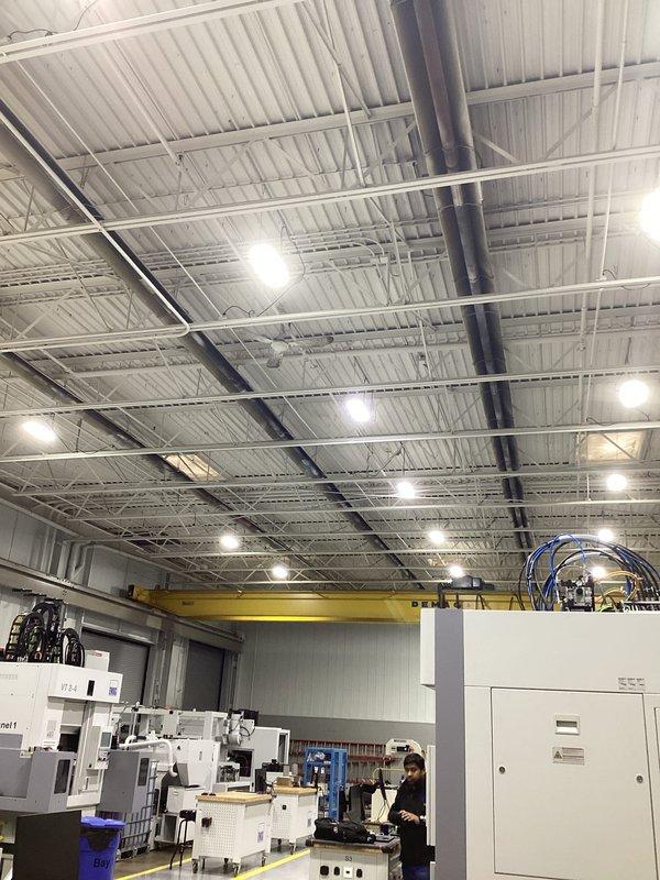 Conducted comprehensive tube heater assessment in industrial manufacturing facility. Evaluated overhead heating system in relation to high-ceiling environment with exposed steel support beams and crane rail systems. Documented current heating infrastructure to determine optimal solutions for maintaining consistent temperature throughout the large production space.