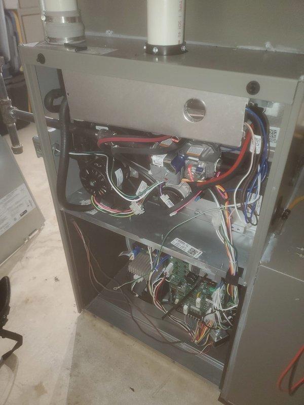 Performed scheduled maintenance on Lennox furnace unit under Worry Free Service Agreement. Inspection included examination of electrical components, wiring connections, and ventilation system with PVC exhaust pipes. All systems verified to be in normal working condition with no signs of damage or malfunction detected.