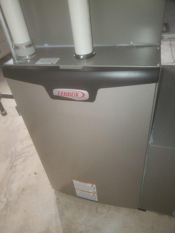 Performed scheduled maintenance on Lennox furnace unit under Worry Free Service Agreement. Inspection included examination of electrical components, wiring connections, and ventilation system with PVC exhaust pipes. All systems verified to be in normal working condition with no signs of damage or malfunction detected.