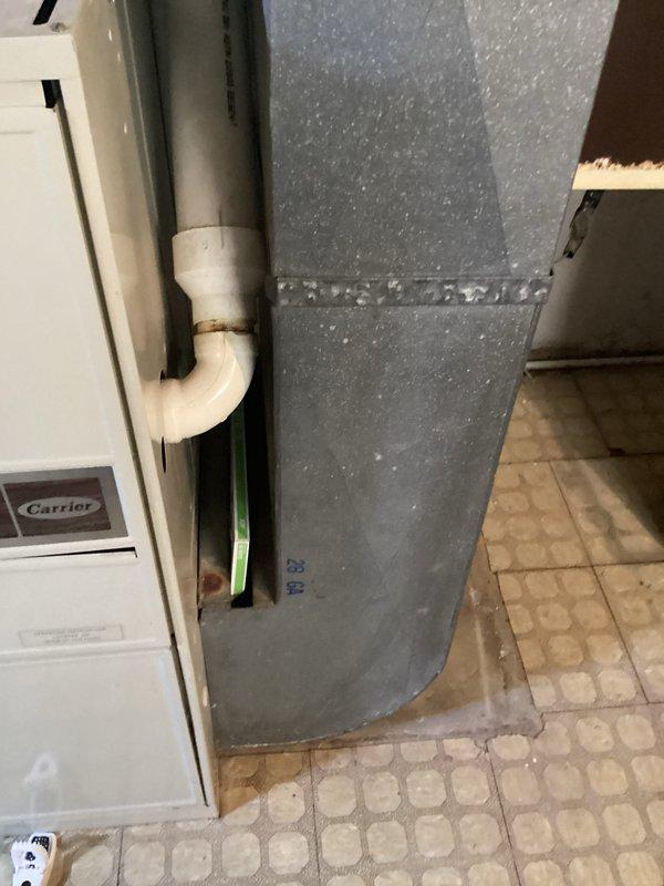 Performed comprehensive evaluation of aging furnace system in 2,000 sq ft residential home. Inspected existing Carrier furnace unit and associated ductwork in basement, noting deterioration and inefficiency concerns. Assessed outdoor Bryant AC unit showing significant winter exposure with snow accumulation. Recommended complete HVAC system replacement to improve energy efficiency and reliability.