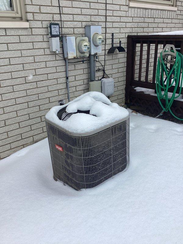 Performed comprehensive evaluation of aging furnace system in 2,000 sq ft residential home. Inspected existing Carrier furnace unit and associated ductwork in basement, noting deterioration and inefficiency concerns. Assessed outdoor Bryant AC unit showing significant winter exposure with snow accumulation. Recommended complete HVAC system replacement to improve energy efficiency and reliability.
