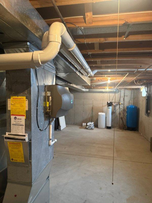 Successfully installed new Lennox furnace and S40 thermostat in unfinished basement area. Installation included proper connection of PVC ventilation pipes with appropriate routing along ceiling joists and installation of condensate drain line. System was fully tested and is operating within manufacturer specifications.