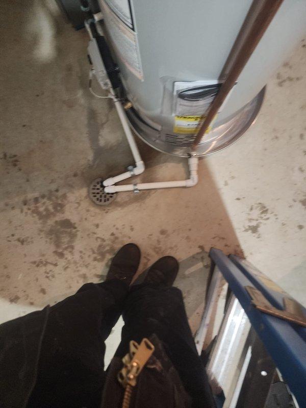Successfully installed a 50-gallon water heater in basement mechanical room, including proper connections to existing copper plumbing and drain line to floor drain. Installation included mounting of expansion tank and testing of all connections to ensure proper operation and no leaks.