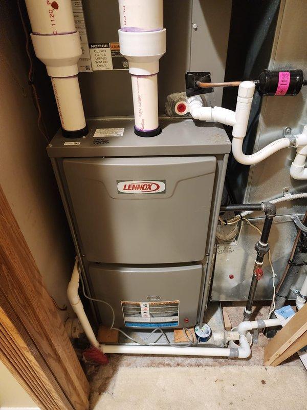 Performed maintenance service on two Lennox heating systems. Inspected furnace components, exhaust/intake PVC piping, and associated connections. Completed consumer rebate-eligible tune-up service with all systems functioning properly.