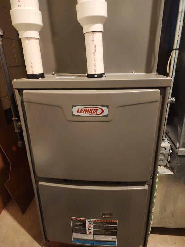 Performed maintenance service on two Lennox heating systems. Inspected furnace components, exhaust/intake PVC piping, and associated connections. Completed consumer rebate-eligible tune-up service with all systems functioning properly.