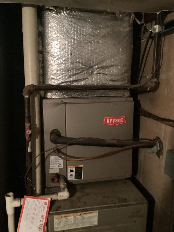Completed replacement estimate for a furnace system featuring a Cause USA unit and a red-tagged Bryant furnace. Documented existing installation with photos showing the complete system setup including PVC drainage pipes, electrical connections, and ductwork with reflective foil insulation. Recommendation needed for full replacement of the commercial 10A-12 furnace system.