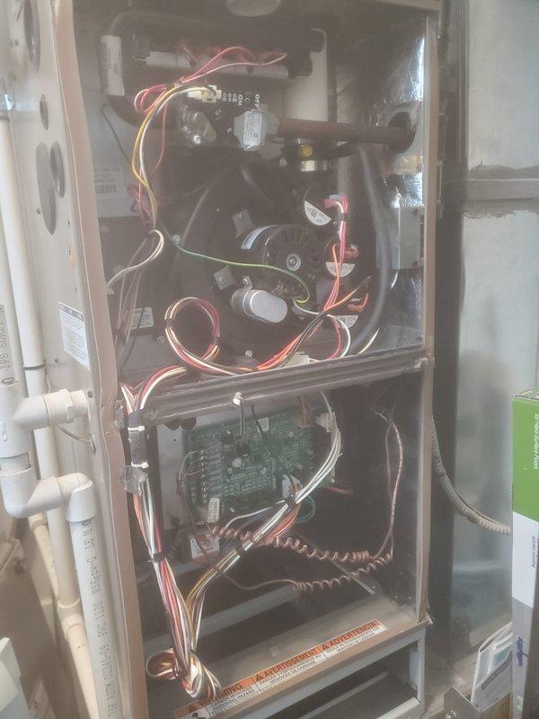 Performed annual heating tune-up on 5-year-old York furnace under Worry Free Service Agreement. Inspected all internal components including blower motor assembly, wiring connections, and circuit board. Verified proper venting through PVC exhaust pipes and confirmed system is operating correctly with no issues identified. Unit is in good condition with maintenance contract valid through 2025.