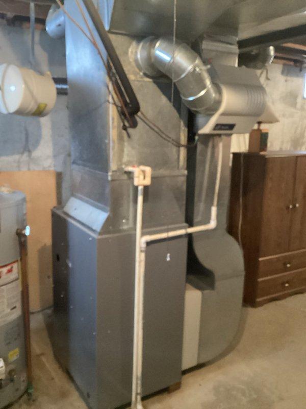 Conducted comprehensive assessment of existing HVAC system in residential basement for replacement quote CQ 03718-01. Current installation features standard furnace with connected ductwork, PVC ventilation components, and proximity to water heater. Documentation completed with detailed photos of system configuration to inform appropriate replacement specifications.