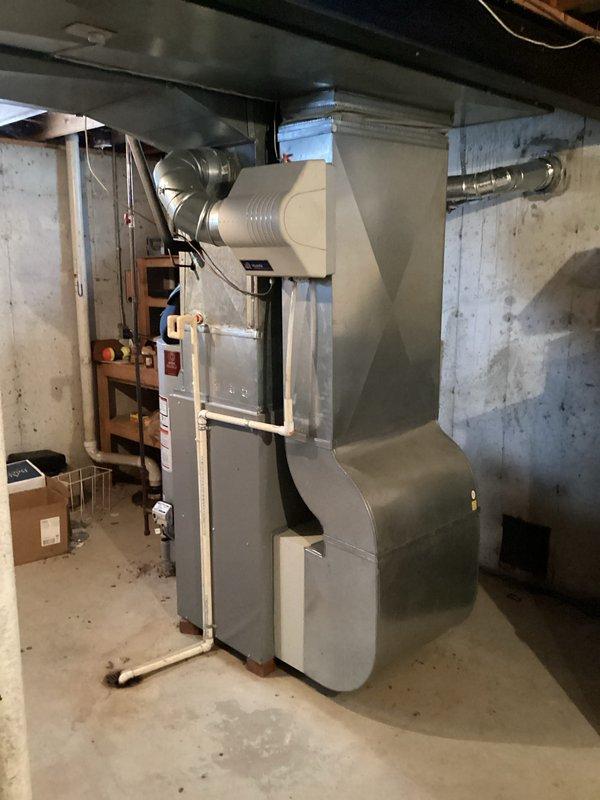 Conducted comprehensive assessment of existing HVAC system in residential basement for replacement quote CQ 03718-01. Current installation features standard furnace with connected ductwork, PVC ventilation components, and proximity to water heater. Documentation completed with detailed photos of system configuration to inform appropriate replacement specifications.