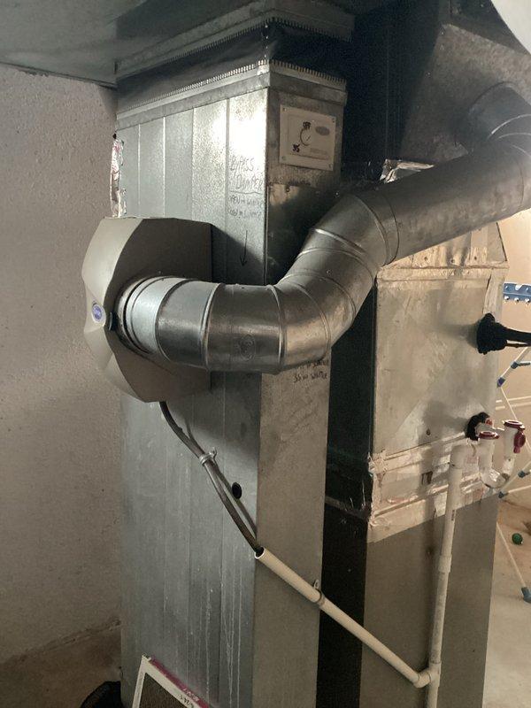 Conducted comprehensive assessment of aging HVAC system requiring replacement rather than repair due to cost inefficiency. Documented existing installation including furnace unit with attached ductwork, control components, and PVC ventilation/drainage system. Prepared estimate for complete system replacement as recommended alternative to expensive repairs on deteriorating equipment.