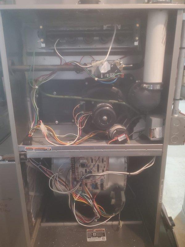 Performed comprehensive furnace maintenance on Bryant HVAC system. Inspected internal components including blower motor assembly, electrical connections, and circuit board. Verified proper installation of PVC venting system and confirmed all components are functioning correctly.