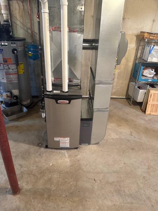 Successfully installed a new Lennox furnace with integrated humidifier in residential basement mechanical room. Installation included proper connection of ductwork with sealed seams, installation of PVC intake/exhaust venting, and complete system testing to verify proper operation. All manufacturer specifications were followed and system is functioning as designed.