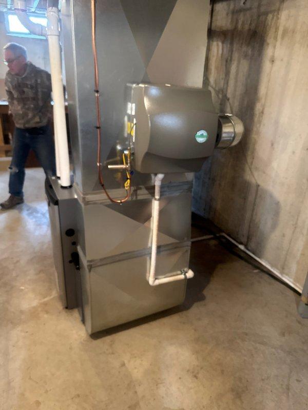 Successfully installed a new Lennox furnace with integrated humidifier in residential basement mechanical room. Installation included proper connection of ductwork with sealed seams, installation of PVC intake/exhaust venting, and complete system testing to verify proper operation. All manufacturer specifications were followed and system is functioning as designed.